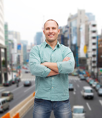 Image showing smiling man with crossed arms