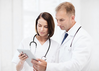 Image showing two doctors looking at tablet pc