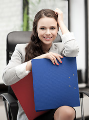 Image showing beautiful smiling woman with folder