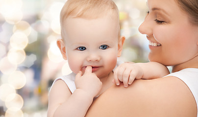 Image showing happy mother with adorable baby