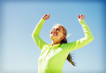 Image showing woman runner celebrating victory