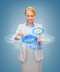 Image showing smiling businesswoman working with virtual screen