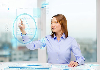 Image showing smiling businesswoman working with virtual screen