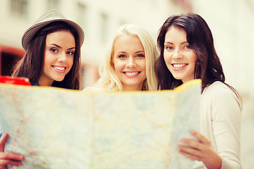 Image showing beautiful girls looking into tourist map in city