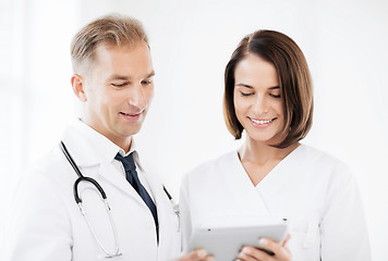 Image showing two doctors looking at tablet pc
