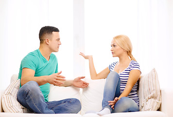 Image showing unhappy couple having argument at home