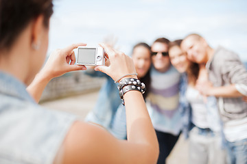 Image showing close up of female hands holding digital camera