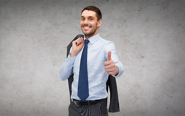 Image showing handsome buisnessman with jacket over shoulder