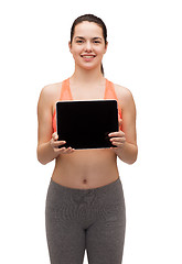 Image showing sporty woman with tablet pc blank screen