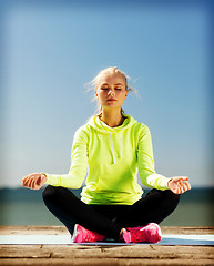 Image showing woman doing yoga outdoors