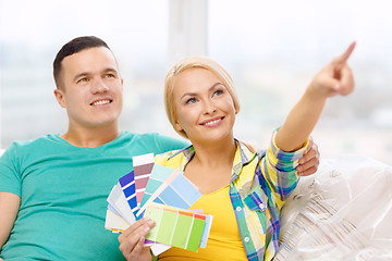 Image showing couple looking at color samples in new home