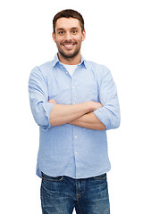 Image showing smiling man with crossed arms