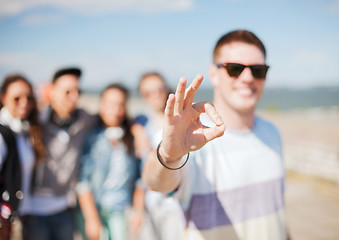 Image showing close up of male hand showing ok sing with fingers