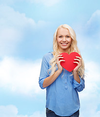 Image showing smiling woman with red heart