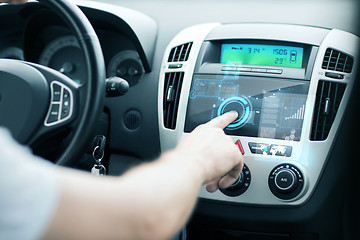 Image showing man using car control panel