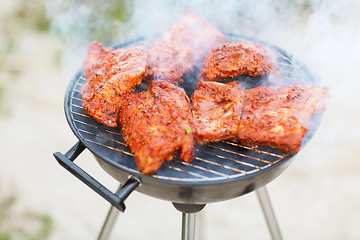 Image showing close up of meat on grill outdoors