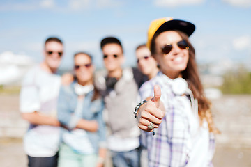 Image showing close up of female hand showing thumbs up