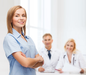 Image showing smiling female doctor or nurse