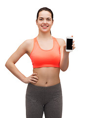 Image showing sporty woman with smartphone