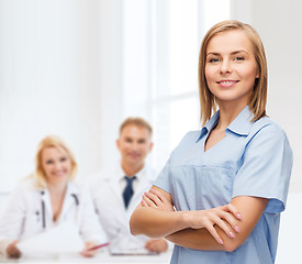 Image showing smiling female doctor or nurse