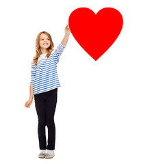 Image showing girl drawing big red heart in the air