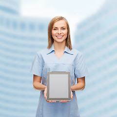 Image showing smiling female doctor or nurse with tablet pc