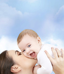 Image showing laughing baby playing with mother