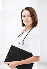 Image showing doctor with stethoscope and clipboard