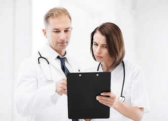 Image showing two doctors writing prescription