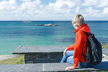 Image showing Happy woman enjoying sea / ocean / fjord view