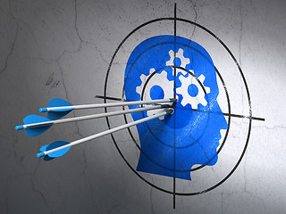 Image showing Advertising concept: arrows in Head With Gears target on wall background