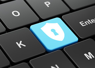 Image showing Protection concept: Shield With Keyhole on computer keyboard background