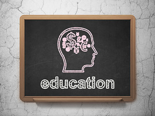 Image showing Education concept: Head With Finance Symbol and Education on chalkboard background