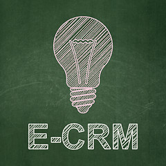 Image showing Finance concept: Light Bulb and E-CRM on chalkboard background