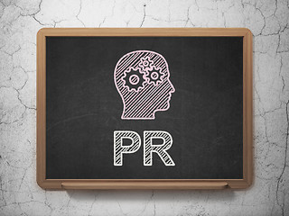 Image showing Marketing concept: Head With Gears and PR on chalkboard background