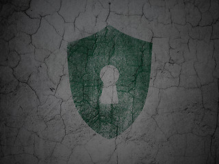 Image showing Protection concept: Shield With Keyhole on grunge wall background