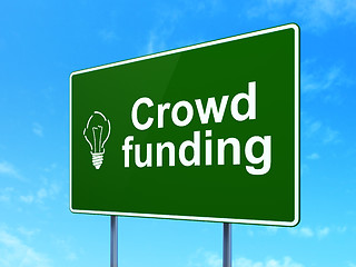 Image showing Finance concept: Crowd Funding and Light Bulb on road sign background