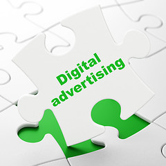 Image showing Marketing concept: Digital Advertising on puzzle background