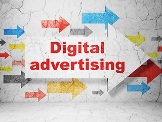 Image showing Advertising concept: arrow with Digital Advertising on grunge wall background