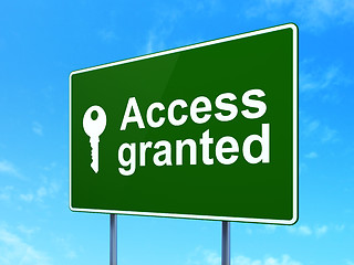 Image showing Protection concept: Access Granted and Key on road sign background