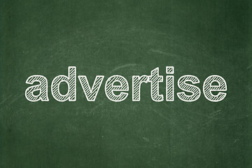 Image showing Marketing concept: Advertise on chalkboard background