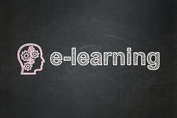 Image showing Education concept: Head With Gears and E-learning on chalkboard background