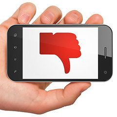 Image showing Social network concept: Thumb Down on smartphone