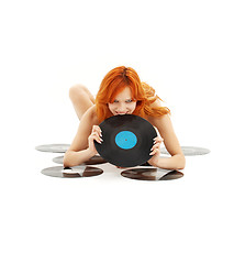 Image showing playful redhead with vinyl records