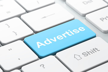 Image showing Advertising concept: Advertise on computer keyboard background