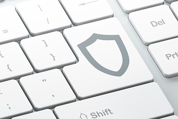 Image showing Security concept: Contoured Shield on computer keyboard background