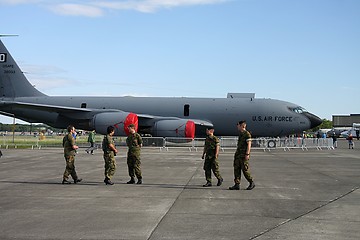 Image showing Soldiers in front of a KC-135  transport plane