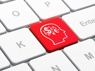 Image showing Advertising concept: Head With Finance Symbol on computer keyboard background