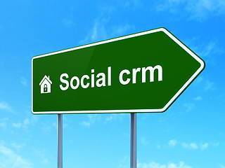 Image showing Finance concept: Social CRM and Home on road sign background