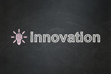 Image showing Finance concept: Energy Saving Lamp and Innovation on chalkboard background